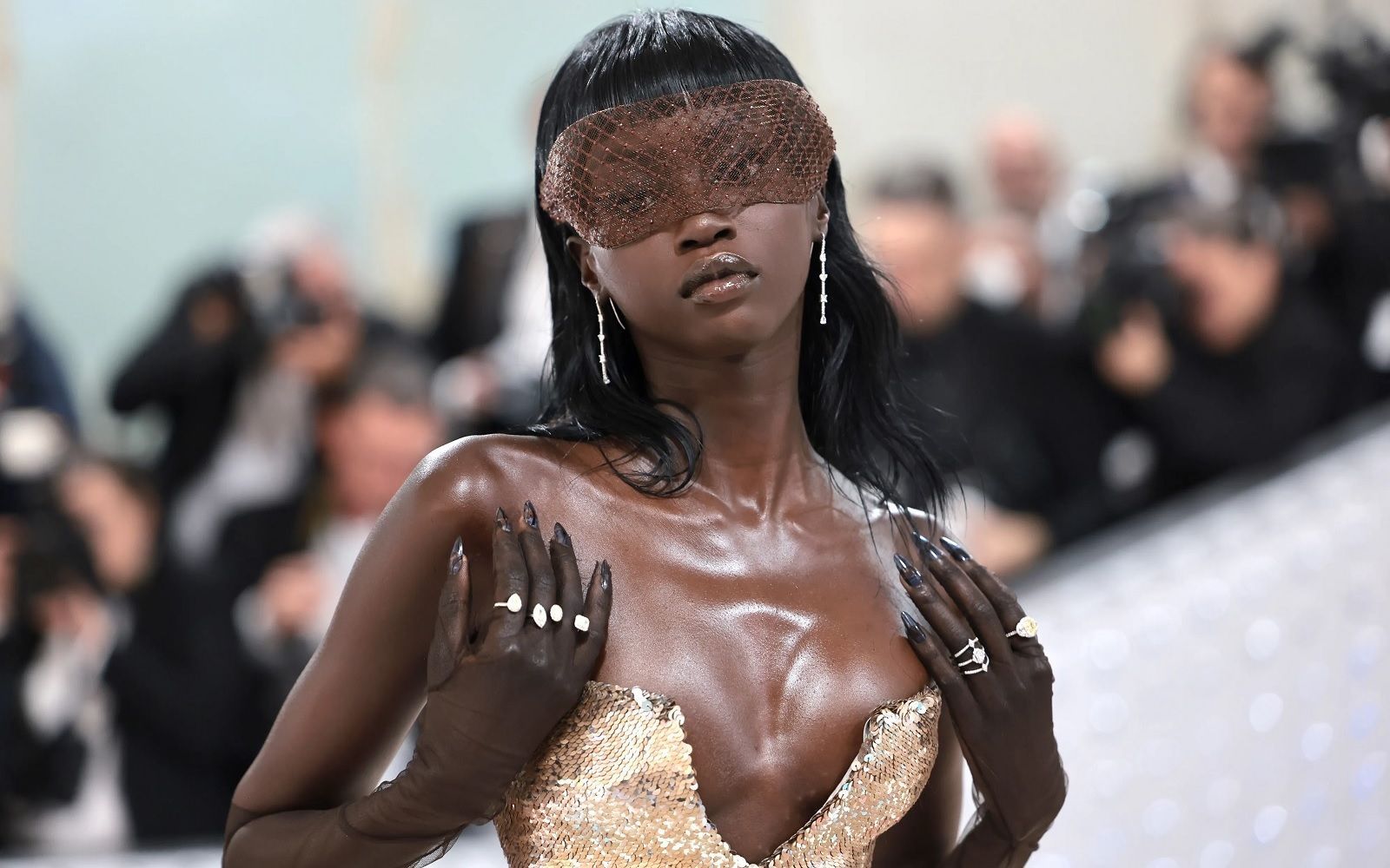 Anok Yai: Model of the Year Complete Bio 2025 9 Anok Yai in elegant gown with striking accessories.