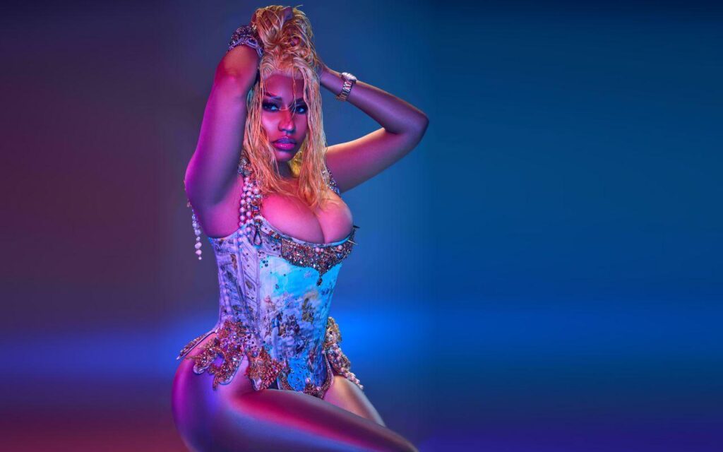 Nicki Minaj in Colorful artistic pose with embellishments.