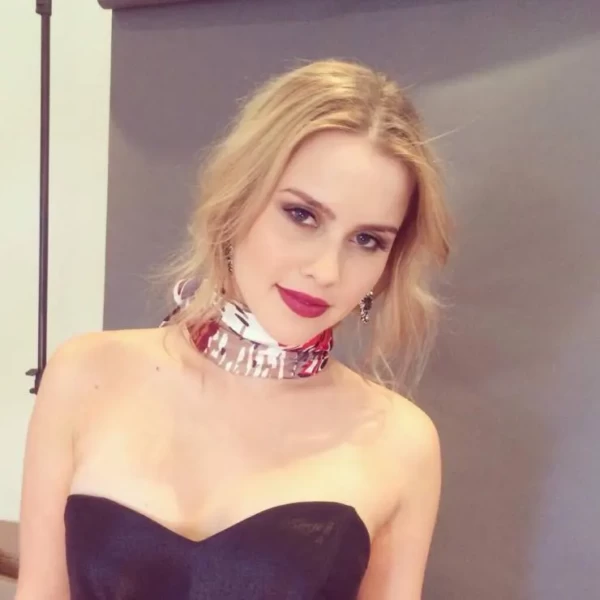 Beautiufl Blonde CLaire Holt in black dress