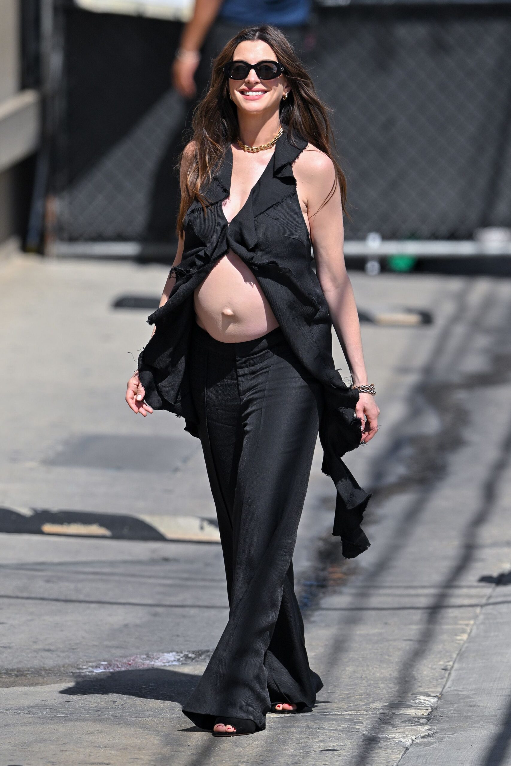 Anne Hathaway responding to fake bump criticism with Fake hair real bump Instagram caption in 2026